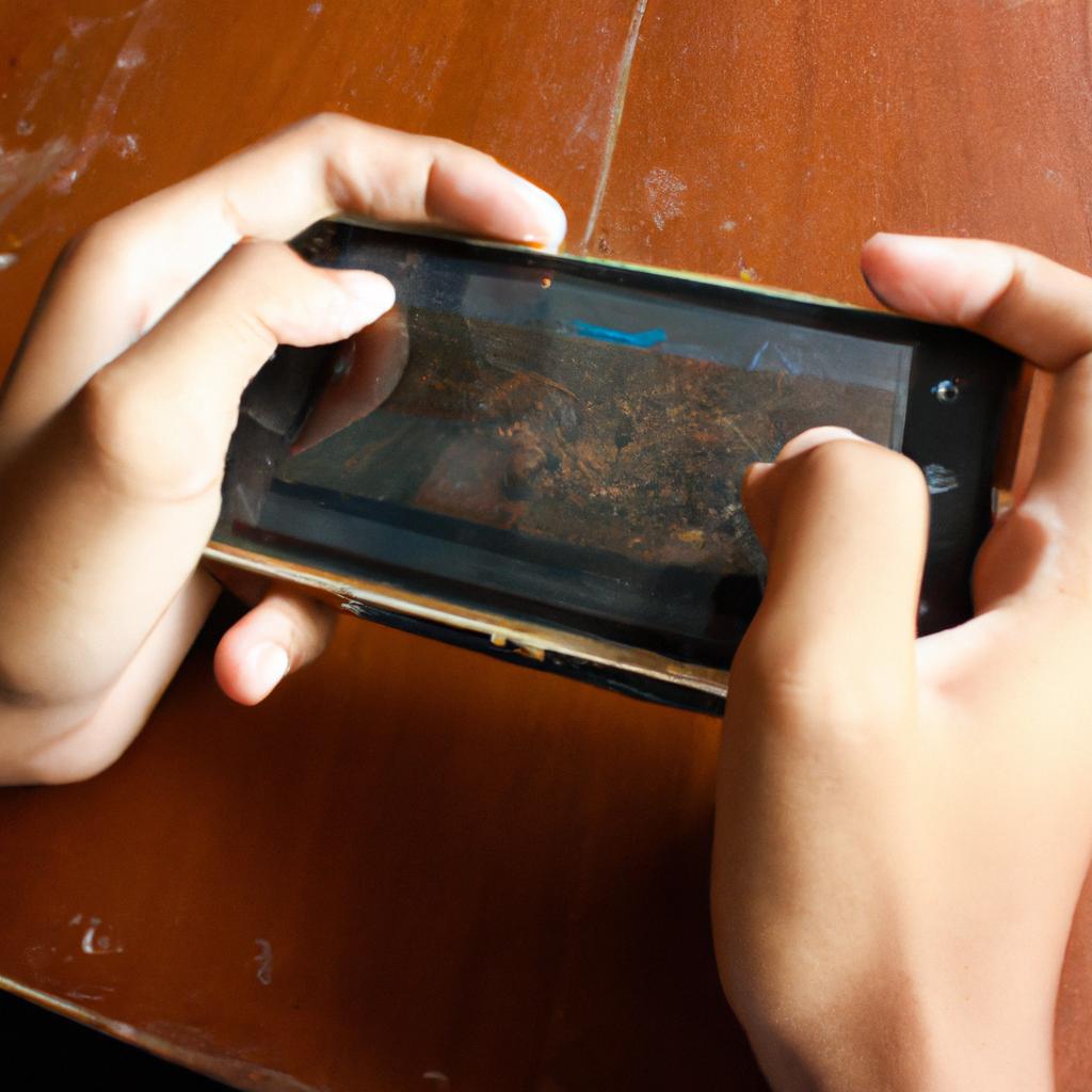 Person playing mobile video game