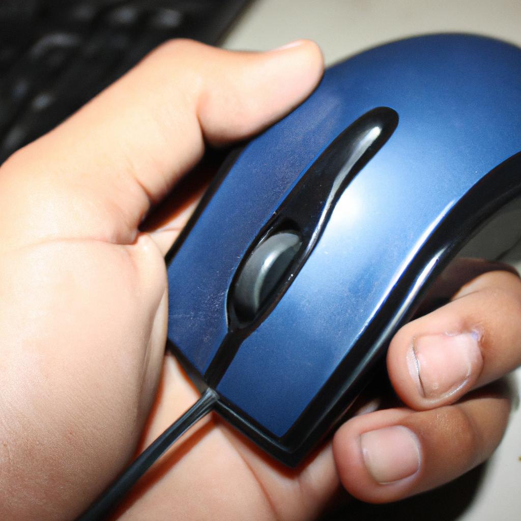 Person holding a computer mouse