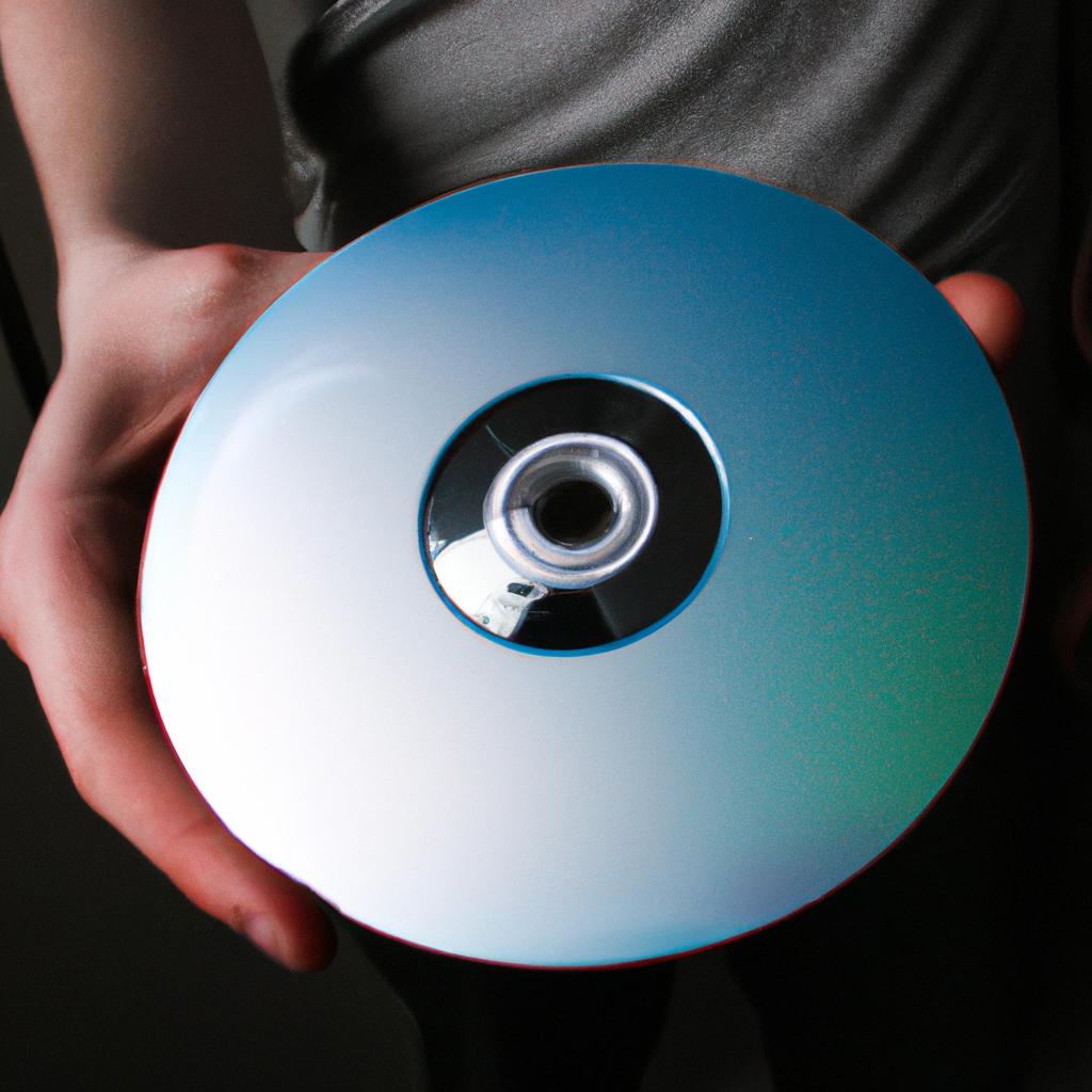 Person holding computer game disc